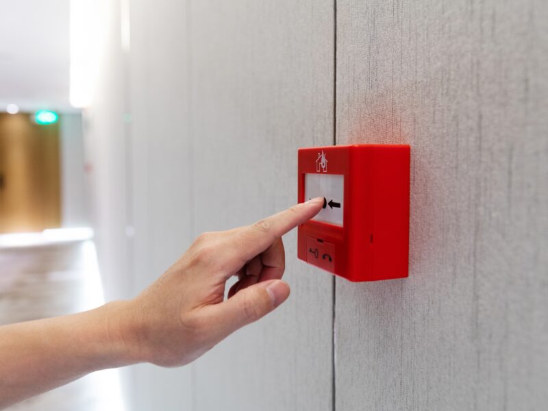 People,Hand,Pressing,Fire,Alarm