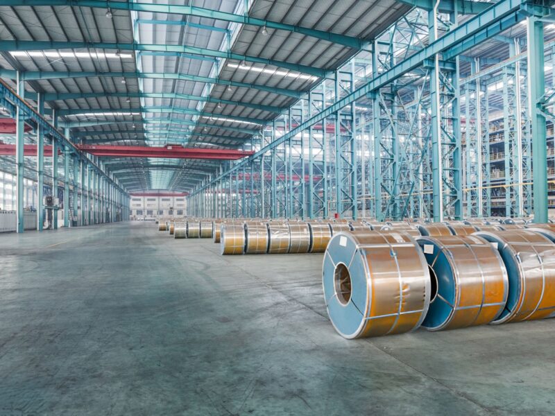 Industrial,Warehouse,Interior,With,Coiled,Steel,Rolls,And,Tall,Racking