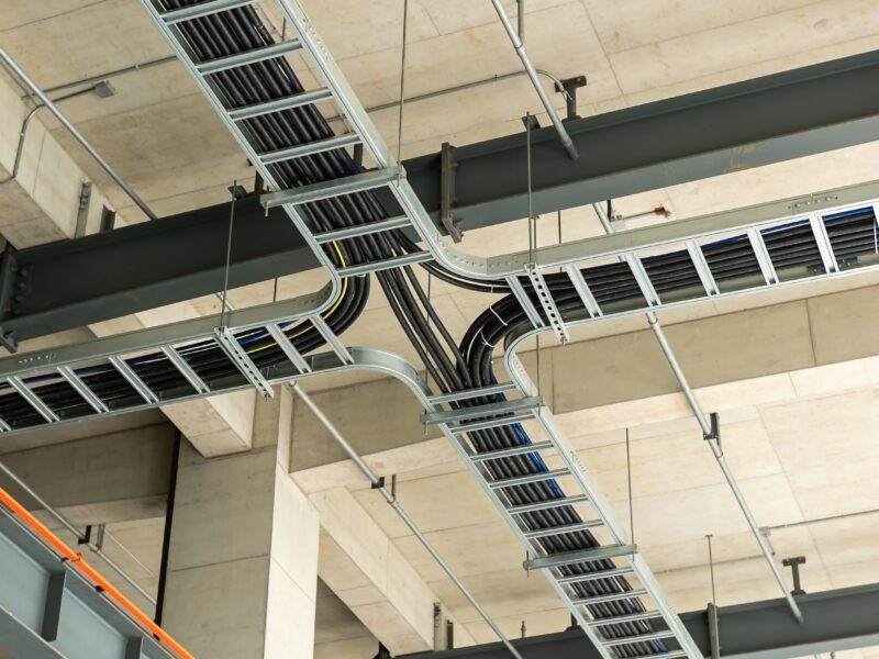 A,Complex,Network,Of,Electrical,Conduits,And,Cable,Trays,Is